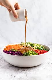 In a food processor or blender, combine and purée the peanut and sesame oils, garlic, sugar, rice vinegar, soy sauce, peanut butter and sesame paste. Healthy Thai Peanut Dressing Ambitious Kitchen