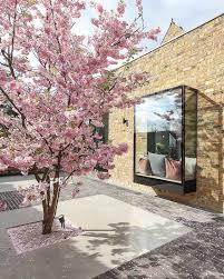 The best know example of flowering bonsai trees is the azalea, a very common tree species used in bonsai. West London Garden With Cherry Blossom