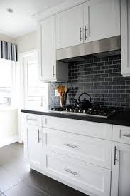 The light fixture is from nessen lighting. White And Black Kitchen Backsplash Ideas Decorkeun