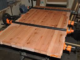 You can use dowels, biscuits, or tongue in a groove for proper alignment as well as improve glue strength. What Is A Good Way To Prevent Jointed Tabletops From Bowing When Tightening Fasteners Or The Glue Sets Woodworking Stack Exchange
