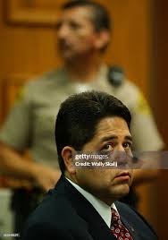 South Gate Treasurer Albert Robles listens to his defense lawyer... News  Photo