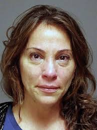 Woman charged with threatening husband with knife