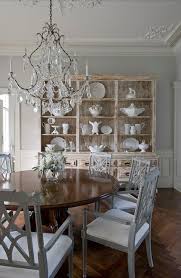 This dining room manages to be at once elegant and approachable, combining a friendly mix of details like its red brick fireplace, casual rug and refined upholstered dining chairs. Formal Dining Rooms Design Ideas