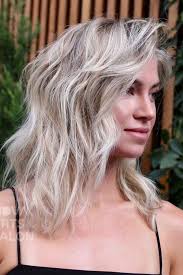 The hair is long with relaxed waves and soft bangs. 50 Nice And Flattering Hairstyles With Bangs Lovehairstyles Com