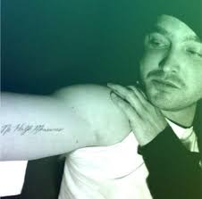 What is the meaning of Aaron Paul's tattoos?