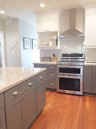 Natural wood and stainless steel notice the small addition of the gray drawers highlighting the white cabinets. Pin By Julie On Kitchens Kitchen Cabinets Decor Kitchen Cabinet Design New Kitchen Cabinets