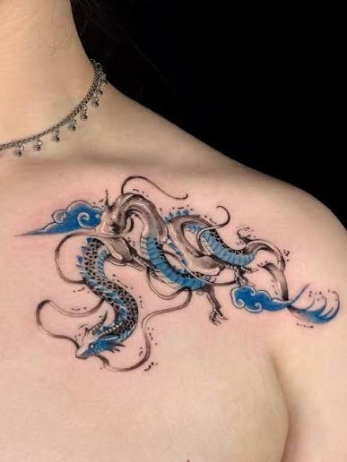 A flowing dragon brought to life with soft shades of black and vibrant blue. 🐉✨ This piece carries both strength and elegance, blending traditional spirit with modern detail. Would you wear a