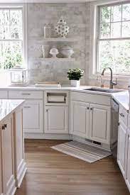 White subway tile, quartz countertops, white enamel pendants and gold fixtures complete the update. Forever Cottage White Kitchen Love Kitchen Remodel Small White Kitchen Remodeling Farmhouse Kitchen Remodel