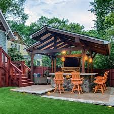 Strategic lighting although outdoor kitchen means you will have ample natural light during so, a roofed lounge with cozy couches, tables and firewood area is perfect. Top 60 Patio Roof Ideas Covered Shelter Designs
