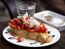 Toasted bread rubbed down with garlic, topped with chopped tomatoes and basil,. Bruschetta Wikipedia