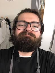 Gandalf is getting a beard trim from Daddy.