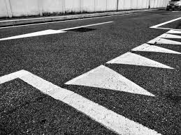 Black And White Road Signs Photo Depicting Road Signs On The Ground Road Signs Have Uniformed Globally Creating Unique Signals For All Stock Photo