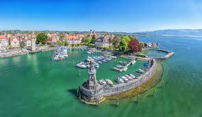 Harbor On Lake Constance With Statue Of Lion At The Entrance In Lindau Bavaria Germany