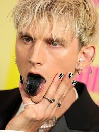 Richard colson baker, better known by his stage name machine gun kelly, is an american rapper from cleveland, ohio, signed to bad boy and interscope records. Why The Hell Did Machine Gun Kelly Dye His Tongue Black For The 2021 Billboard Music Awards Allure