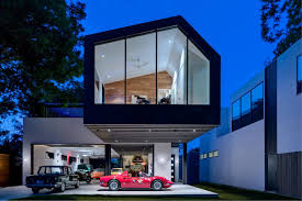 Matt Fajkus Architecture Designed The Jaw Dropping Autohaus Residence In Austin Texas That Floats Over A Massiv Austin Homes Garage Design Garage House Plans