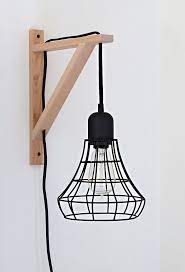 Diy Cage Light Sconce A Clever Idea Using The Threshold Industrial Plug In Pendant And An Ikea Ekby Valter Ikea Diy Diy Hanging Shelves Diy Home Decor Projects