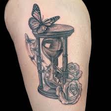 This is a creative hourglass tattoo that has been done on the side of the hands. 62 Best Hourglass Tattoo Design Ideas With Meaning
