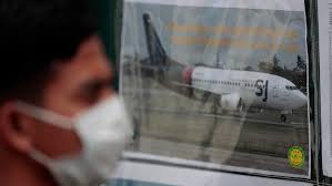 Rescue workers carry debris off a search and rescue ship at the port in jakarta on january 10, 2021, during the search operation for sriwijaya air flight sjy182 which crashed. Indonesian Plane Crash Black Box Found Al Arabiya English