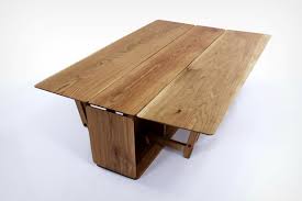 The Lido Table S Hinged Side Panels Give It The Ability To Expand To 3 Times Its Size Yanko Design In 2020 Transforming Furniture Panel Siding Table Legs