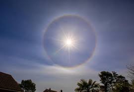 Halo (from greek ἅλως, halōs) is the name for a family of optical phenomena produced by light (typically from the sun or moon) interacting with ice crystals suspended in the atmosphere. Pictured Rare Sun Halo Spotted In The Skies Over Dorset Bournemouth Echo