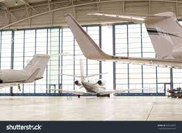 Photos Of Small Airplane Hangers Small Passenger Airplane Leaving Brightly Lit Hangar Through Openin Innovative Architecture Small Airplanes Tiny House Cabin