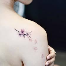 Cherry blossom tattoos for women. Cherry Blossom Tattoo On The Right Shoulder Blade