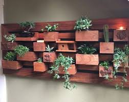 Our planters buying guide can point you in the right direction when selecting your planters. Modern Wall Planter Vertical Succulent Wall Art Wall Etsy Succulent Garden Indoor Living Wall Planter Vertical Succulent Gardens