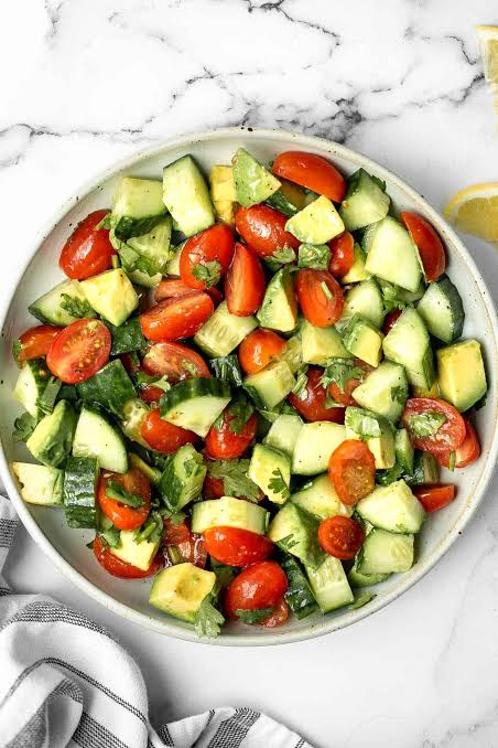 Vibrant Avocado Cucumber Tomato Salad base, AI generated