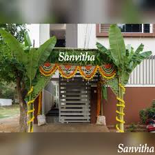 Mango Leaves Thoranam With Marigolds Sanvithas 7997458082 Flower Decor In 2020 Wedding Design Decoration Wedding Backdrop Design Decor