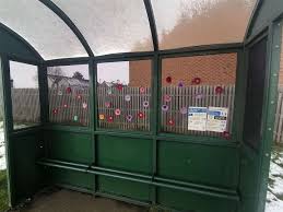 The knitter has the option of making him with his trunk up or down; Knitting Banksy Brightens Market Deeping Bus Shelter With Flowers