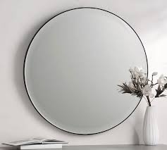 Light that bounces off a mirror will show an image of whatever is in front of it, when focused through the lens of the eye or a camera. Madalyn Round Beveled Edge Wall Mirror 36 Pottery Barn