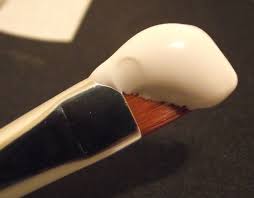A mixture of plaster of paris and glue used to prepare a surface for painting. Gesso Wikipedia