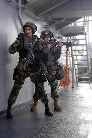 File:US Navy 031018-N-4055P-011 Lance Cpl. Leighton Becker talks with  teammates over the radio.jpg