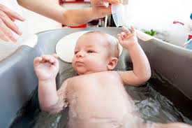 Baby bath tub 4 photos · curated by anne quaranta. A Baby Girl Having A Bath In A Kitchen Lomener Brittany France Stockphoto