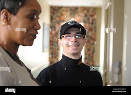 Deborah Laws, unit assistant, talks with Aidan Sims of the U.S. Capitol  Police, at the National Rehabilitation Hospital