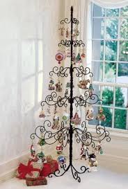 Close up of christmas trees branches with white lights. Wrought Iron Christmas Tree Idee Sapin Noel Sapin De Noel Noel