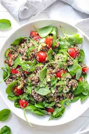 You don't have to worry about overeating with quinoa. Quinoa Salad With Tomato Cucumber Spinach Recipe Elle Republic