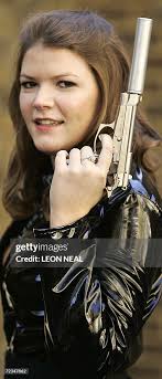 Christie's auction house employee Leonie Ashfield holds the Beretta... News  Photo