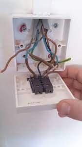 To wire a double switch, you'll need to cut the power, remove the old switch, then feed and connect the wires into the double switch fixture. Replacing A Standard 2 Gang Light Switch With An Electric Dimmer Switch Home Improvement Stack Exchange