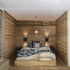 Reclaimed wood adds character to a wood accent wall bedroom. Count Sheep With 17 Above The Bed Lighting Ideas Ylighting Ideas