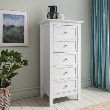 Consider a warm white chest of drawers with a weathered finish to boost the room's cozy feel. Karlstad Chest Of Drawers 5 Drawer Tall Noa Nani