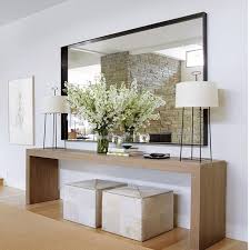 Such A Great Vignette For A Foyer Recipe For Success Long Lean Console Table Ottomans That Can Be Pulled Out For Extra Hall Decor Interior House Interior