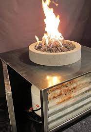 Steel Fire Table With Round Lava Stone Fire Pit From Impact Imports Of Boise And Philadelphia Fire Table Fire Pit Stone Fire Pit