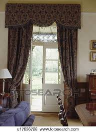 To decorate it in a way that inspires you and fills you with happy memories will ensure it remains a place you enjoy. Dark Blue Patterned Curtains On French Windows In Country Living And Dining Room Stock Photo U17636728 Fotosearch