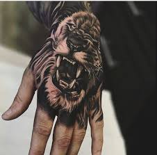 Pin By Rafael Lepritie On Tattoos Lion Hand Tattoo Lion Hand Tattoo Men Hand Tattoos For Guys