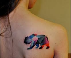 Bear tattoo designs can take on numerous characteristics. Colorful Geometric Small Polar Bear Tattoo On Right Shoulder For Girl