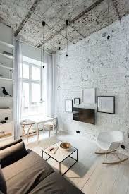 White brick wallpaper brightens the room and can work as a great contrast to bright, bold furniture. Living Room Design With Brick Walls A Rough Ceiling And Minimalist Lamps Brick Living Room Living Room White Living Room Decor Apartment