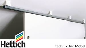 The ceiling track was screwed into the plaster with some thin wood screws through the ?drywall?. Adapter For Sliding Doors Below Sloping Ceilings Do It Yourself With Hettich Youtube
