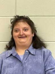 Maybe Ms. Sharp's favorite photo of the day…. Sweet Sara Gautier who  brought her East Central Hornets to our JCES Job Extravaganza ended up with  an unexpected tag-a-long from our Fish Market!