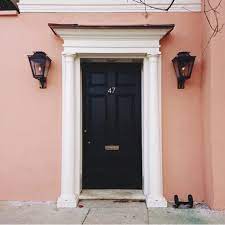 It becomes quite a tricky job to blend perfect color combinations that will awe the viewer. Peach House Black Door House Doors Colors Pink House Exterior Coral House